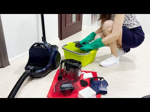 A girl in a dress cleans and washes a bagless vacuum cleaner. Bosch BGS21X320. Part 19