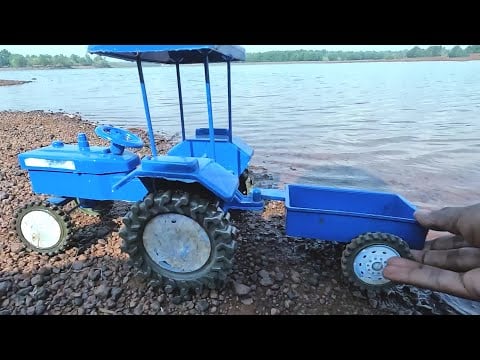 mini Swaraj tractor stuck in mud jcb Loading parle g biscuits help tractor Video | jcb video