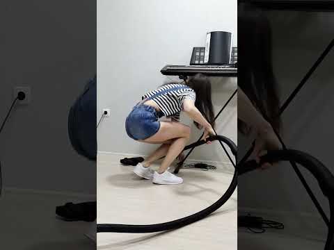 House cleaning. A girl in shorts vacuums the house without a bag with a Bosch BGS21X320 #short