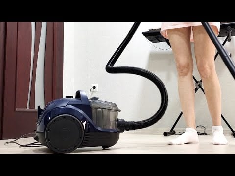 Bosch BGS21X320. A girl in pajamas cleans the house with a bagless vacuum cleaner. Part 3