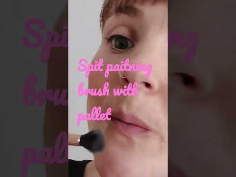 Spit painting with brush and pallet