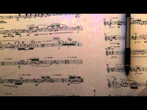 Writing in pencil on music, whispering, tapping