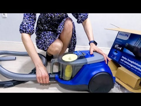 Unpacking the Philips 2000 Series XB2125/09 Bagless Vacuum Cleaner. First test. A girl in a dress