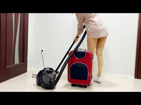 How to vacuum a travel suitcase? Girl in shirt vacuuming with Bosch BGS21X320. clean with me