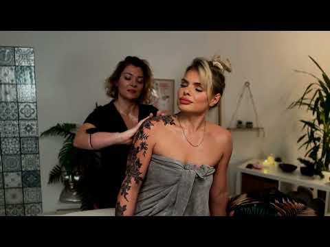 Mila and Olivia focus on back massage techniques, their hands working in harmony to ease tension and