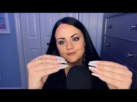 ASMR whispering w/ some nail tapping