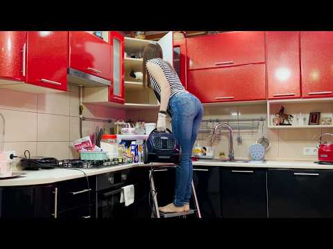 Cleaning a Wall-Mounted Corner Kitchen Cabinet: Decluttering and Vacuuming