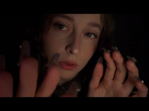 ASMR close up lens taps with inaudible whispers