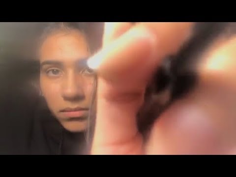 ASMR applying mascara and brushing eyebrows