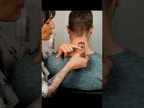 Applying make up on his neck