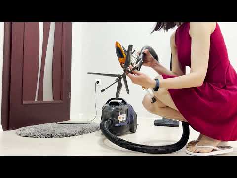 We clean the helicopter with a vacuum cleaner. Girl in a red dress. Vacuum cleaner Bosch BGS21X320
