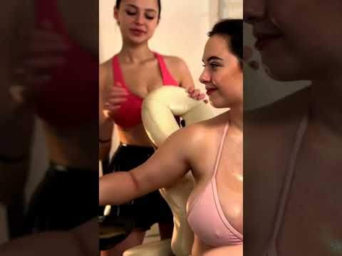 Veronica and Kate work in harmony on the Client's back, their hands tracing gentle pressure and circ