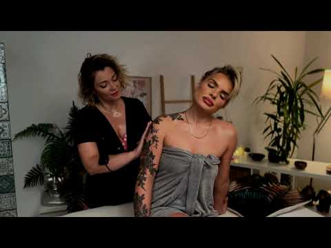 Mila and Olivia focus on back massage techniques, their hands synchronized in a soothing duet of pre