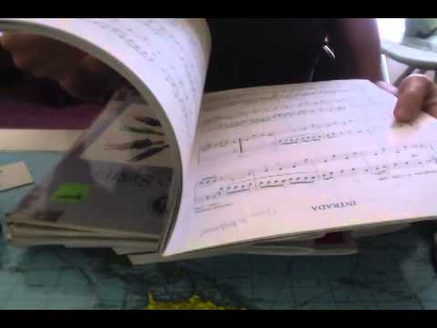 ASMR flipping through old piano books, some inaudible whisper