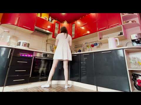 A girl in a dress cleans the kitchen. Cleaning gas stove, countertops. Clean with me