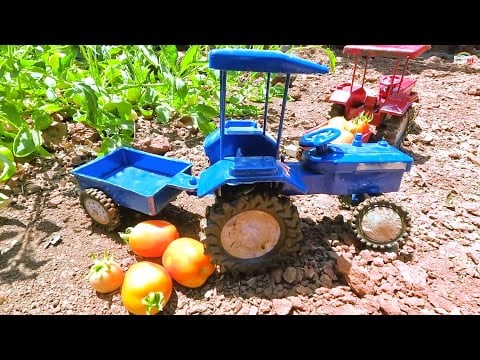 Mini Tractor stuck in mud with tomato helping mini John Deere tractor