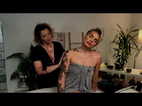 Mila and Olivia focus on back massage techniques, their hands synchronized in a soothing duet of pre