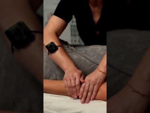 Mila and Olivia focus on back massage techniques, their hands working in harmony to melt tension int