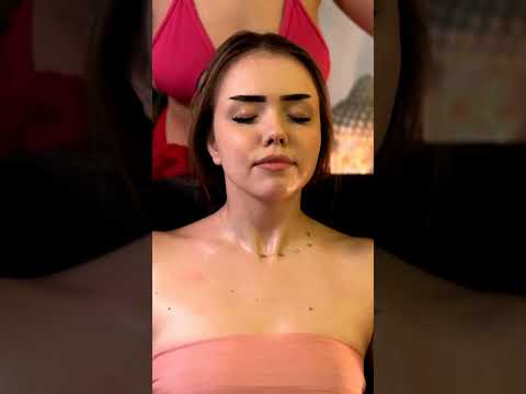 Veronica's hands press into tense muscles as she focuses on back massage techniques, warm oil poolin