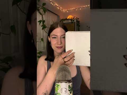 scratching and tapping on sparkly paper