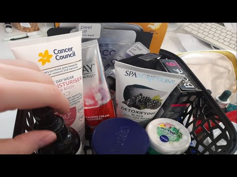 ASMR rummaging + showing you skincare products, chewing gum (whispered)