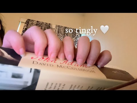 asmr tapping/scratching on the spines of books 