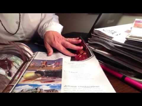 ASMR travel agent role play, whispered, with page turning