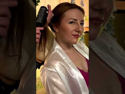 Mira smooths warm oil through the Client's hair, her hands tracing gentle circles as the Client's sh