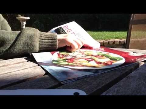 ASMR turning pages of magazine (outside); no talking