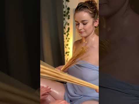 Veronica's hands glide over the Client's back, using gentle circular motions and bamboo sticks for a