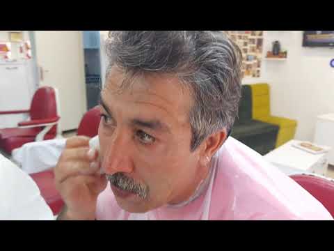 MUNUR ONKAN, THE WINNER OF TURKEY IN HAIR CUTTING, SHAVES HIMSELF