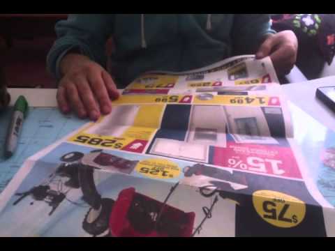Flipping through a newspaper flier while drinking tea -No talking