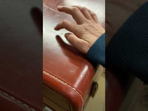Tapping on a suitcase.